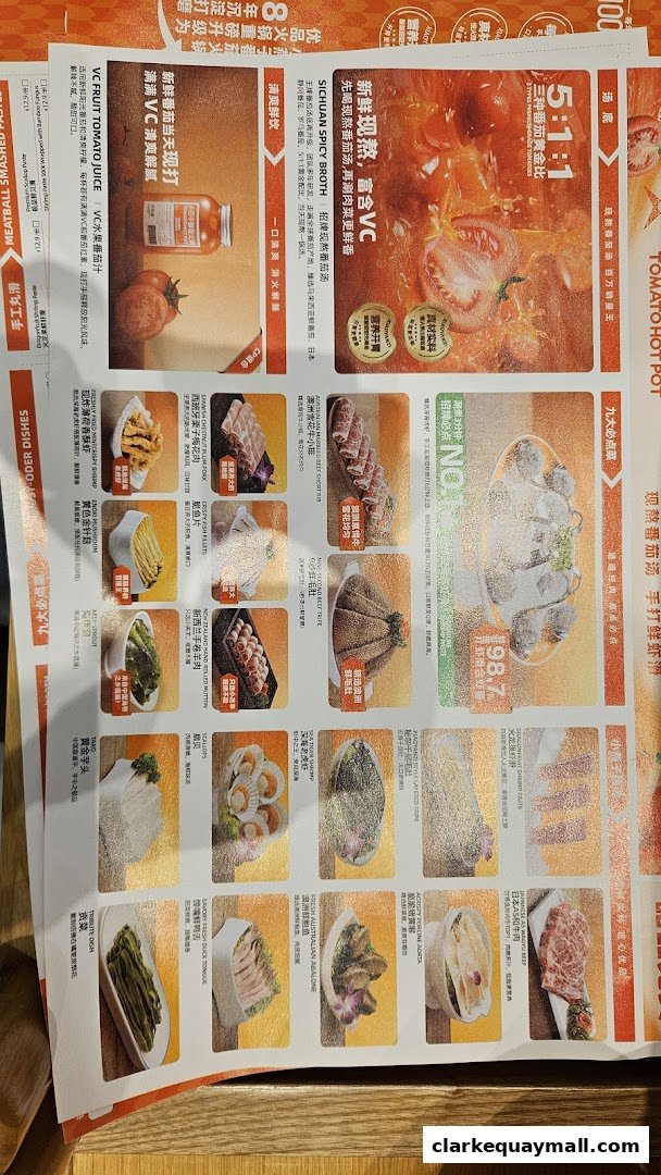 A menu featuring various hot pot ingredients and drinks, with a focus on tomato-based broth.