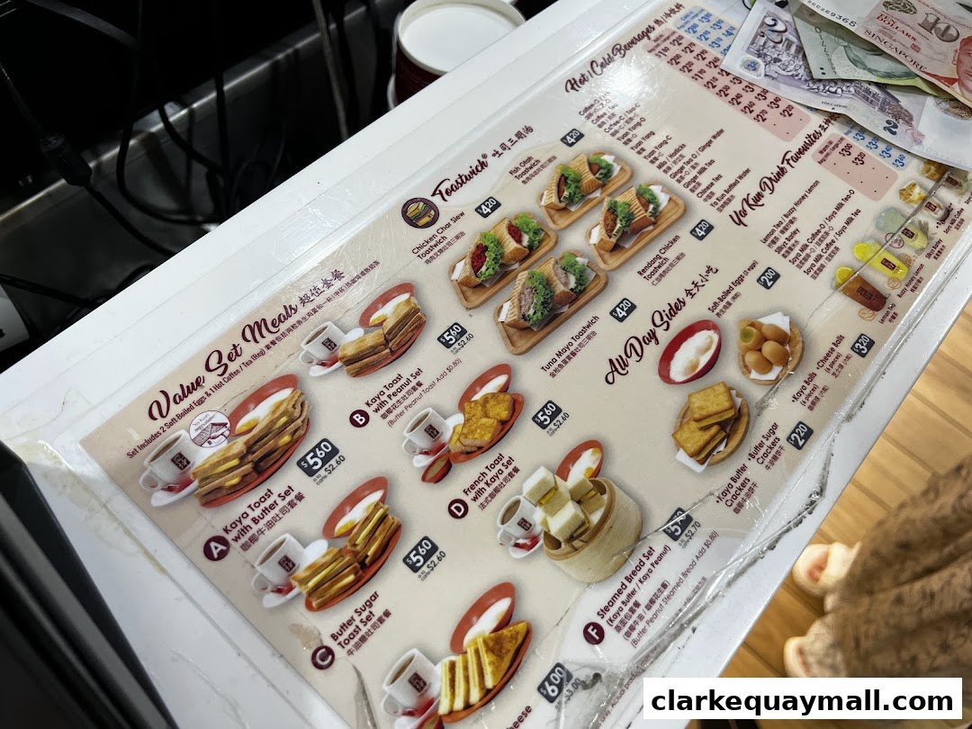 A menu from Ya Kun Kaya Toast featuring set meals, sandwiches, and drinks.