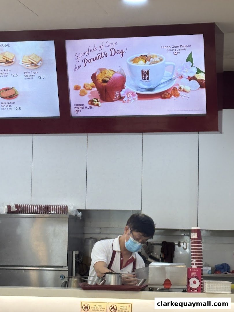 A menu board displays food items and a special Parent's Day dessert at Ya Kun Kaya Toast.