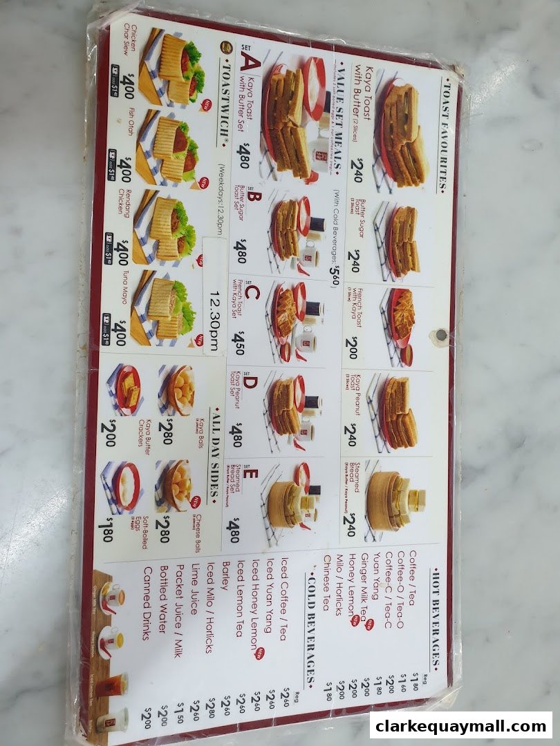 A menu from Ya Kun Kaya Toast featuring toast, sandwiches, sides, and beverages.