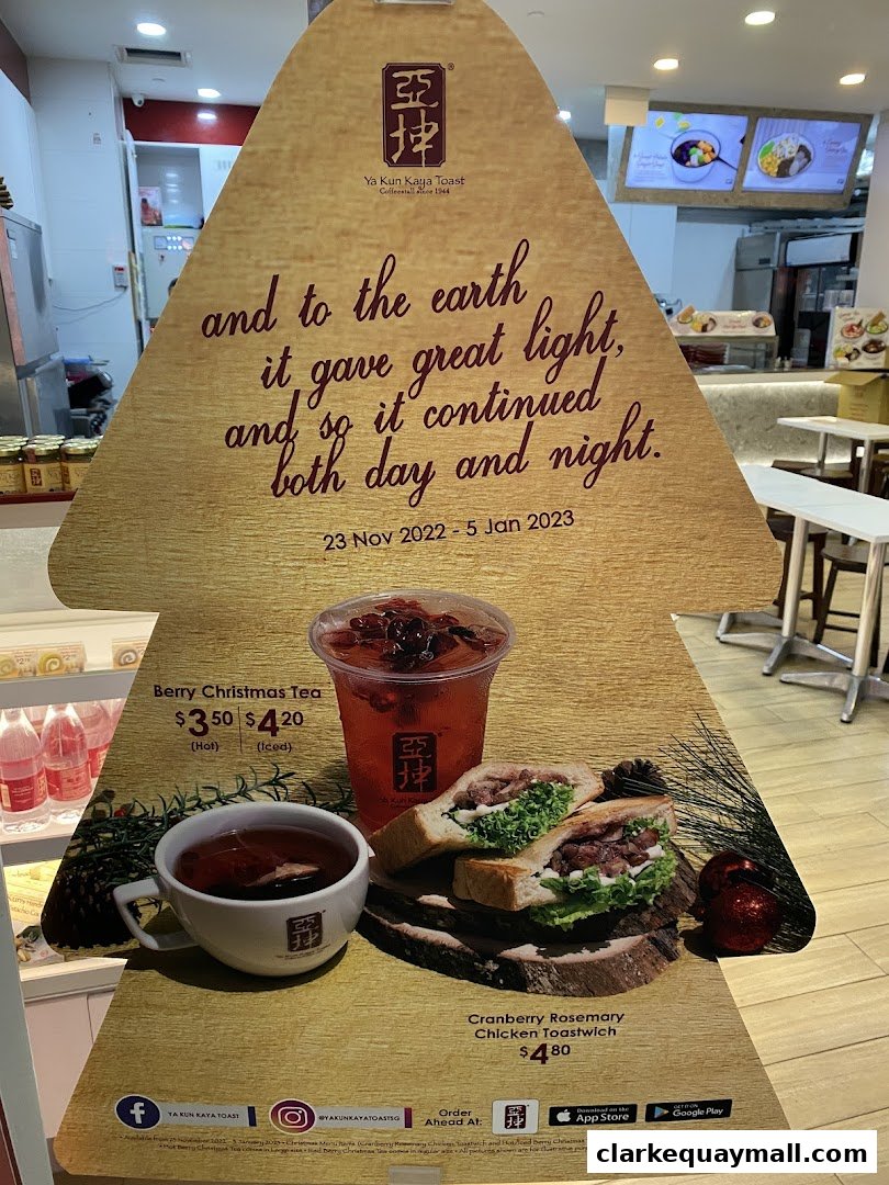 A festive promotional display for Ya Kun Kaya Toast featuring holiday-themed food and drinks.