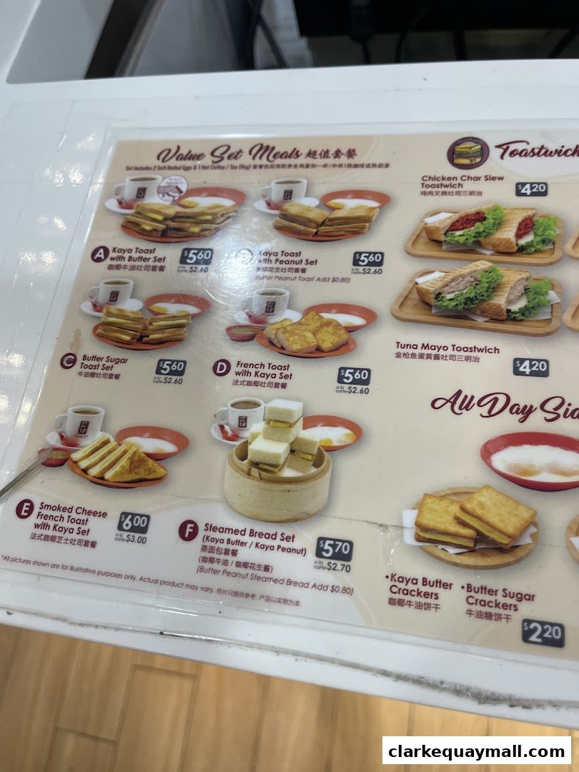 A menu board displaying various set meals and toastwiches from Ya Kun Kaya Toast.