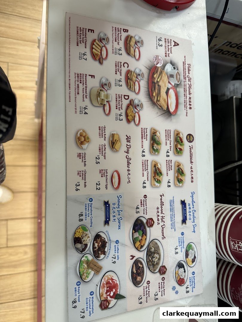A menu from Ya Kun Kaya Toast featuring various sets, toastwiches, desserts, and drinks.