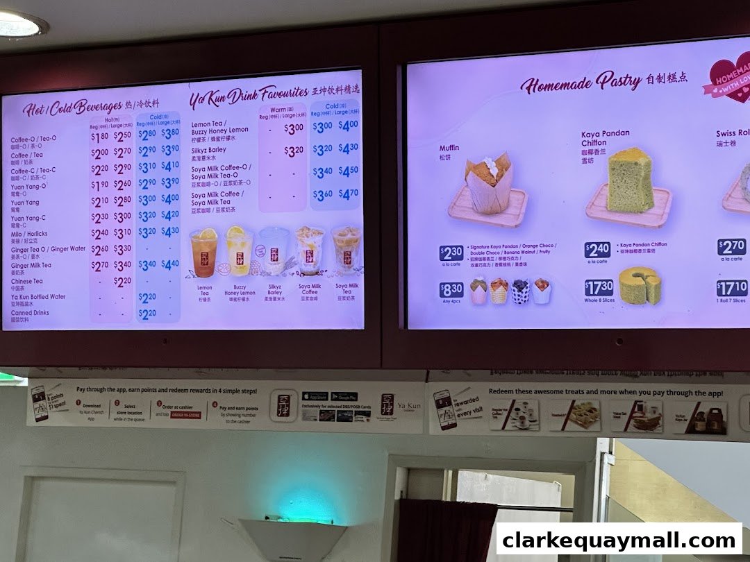 A digital menu board displaying drinks and pastries at Ya Kun Kaya Toast.