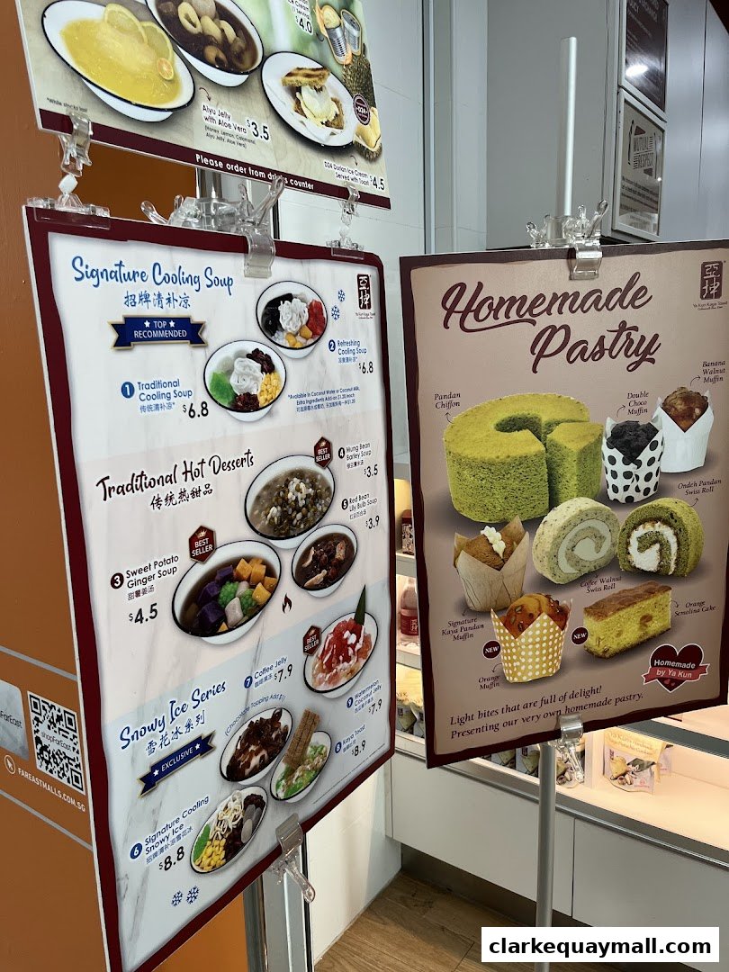 A display of menus for Ya Kun Kaya Toast, showcasing cooling soups and homemade pastries.