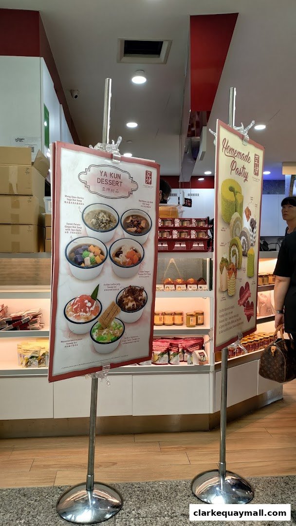 Two display stands showcasing desserts and pastries at Ya Kun Kaya Toast.