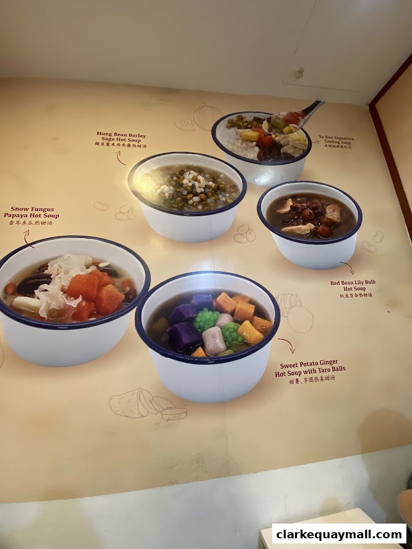 A display of various hot and cooling dessert soups offered at Ya Kun Kaya Toast.