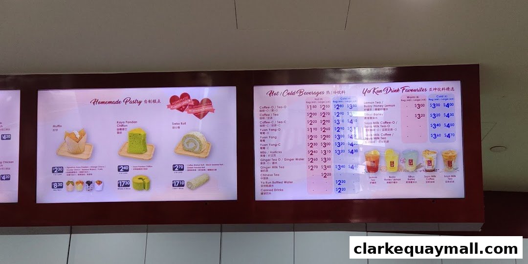 A menu board displaying homemade pastries and hot/cold beverages from Ya Kun Kaya Toast.