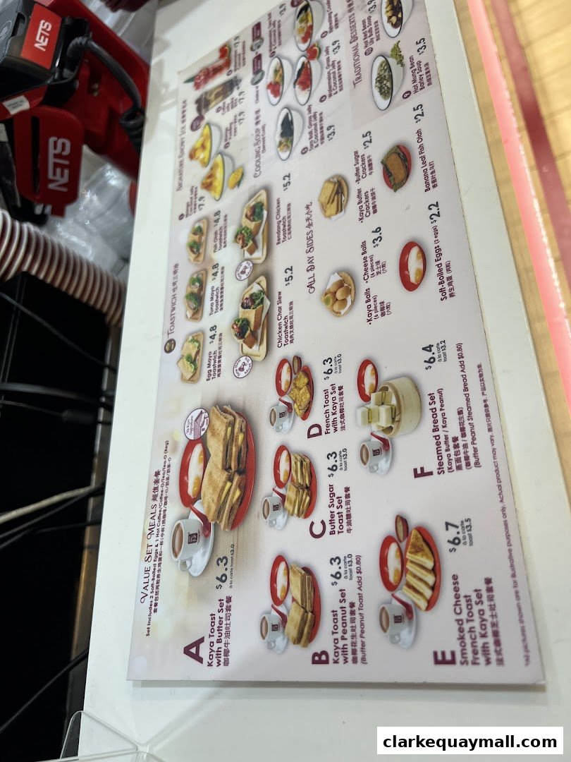 A menu from Ya Kun Kaya Toast featuring various set meals, toastwiches, and traditional desserts.