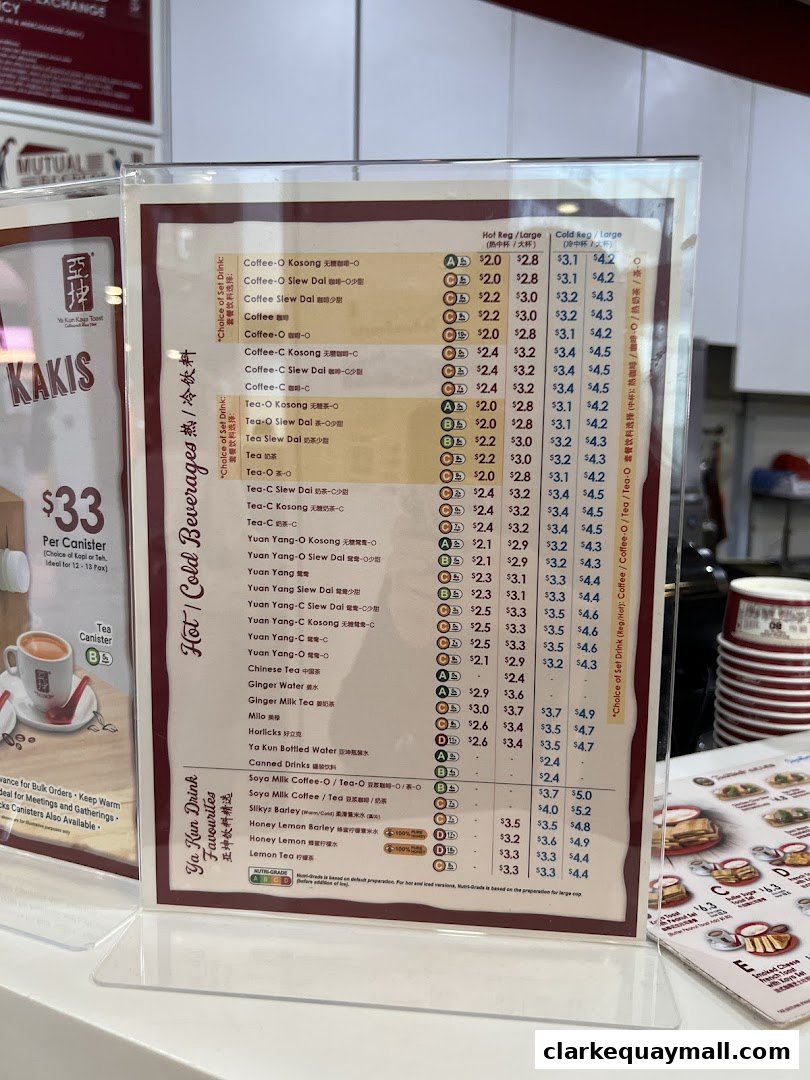 A menu board displaying various hot and cold beverages with prices at Ya Kun Kaya Toast.
