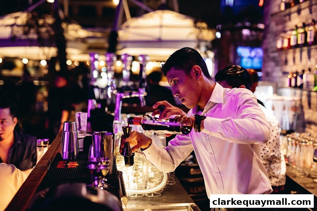 A bartender meticulously prepares a drink behind a well-stocked bar with ambient lighting.