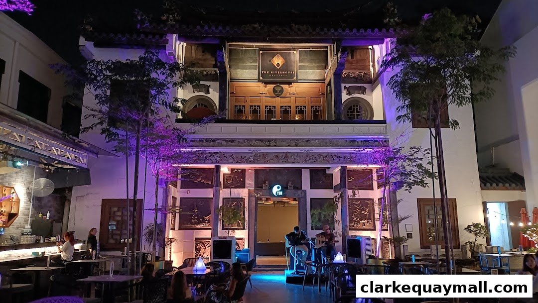 A lively outdoor seating area at Yin Bar Singapore with live music and ambient lighting.