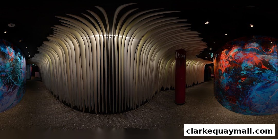 Interior view of Zouk Singapore with unique wavy ceiling and vibrant art installations.